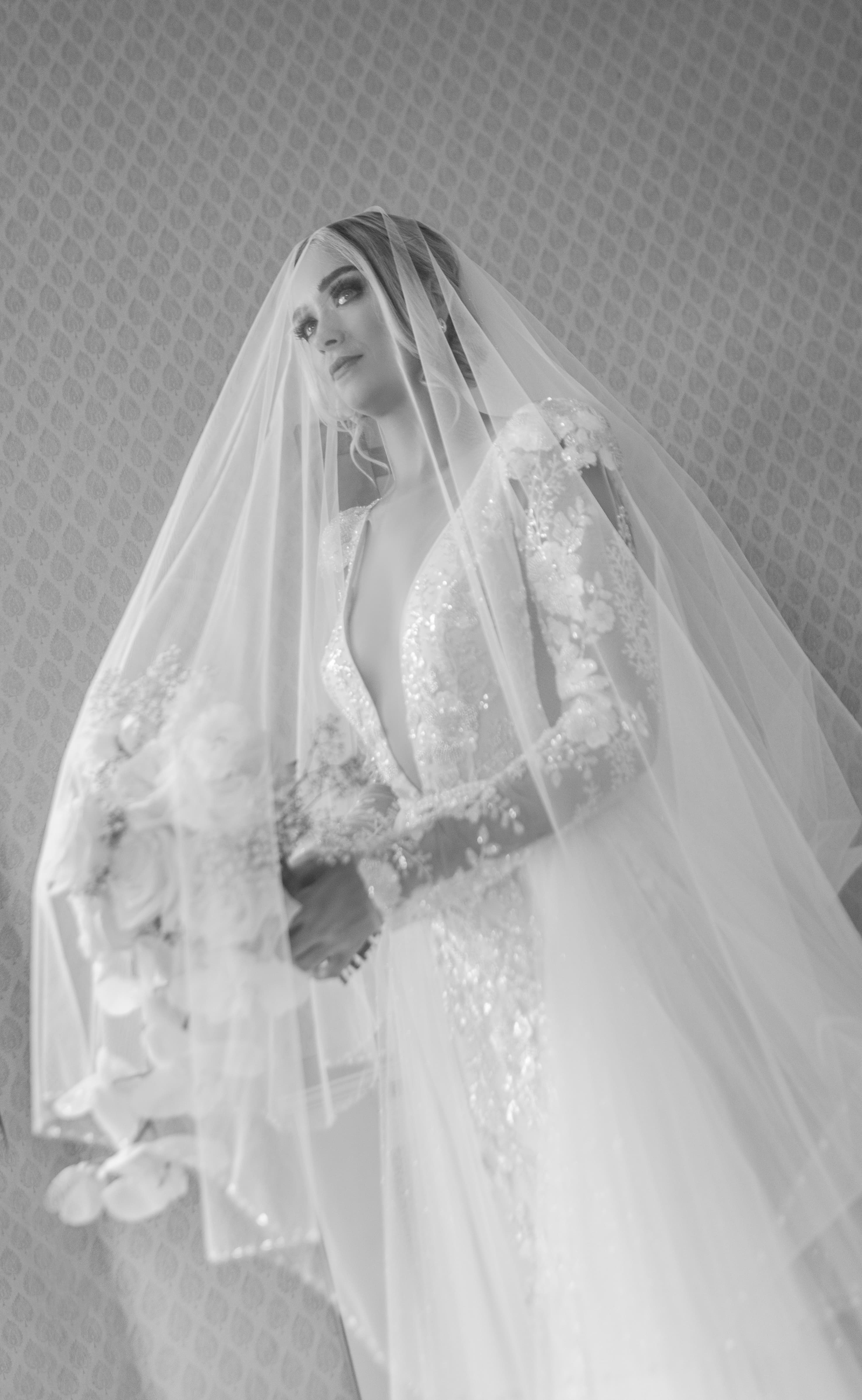 Bride, serene, veil over her face