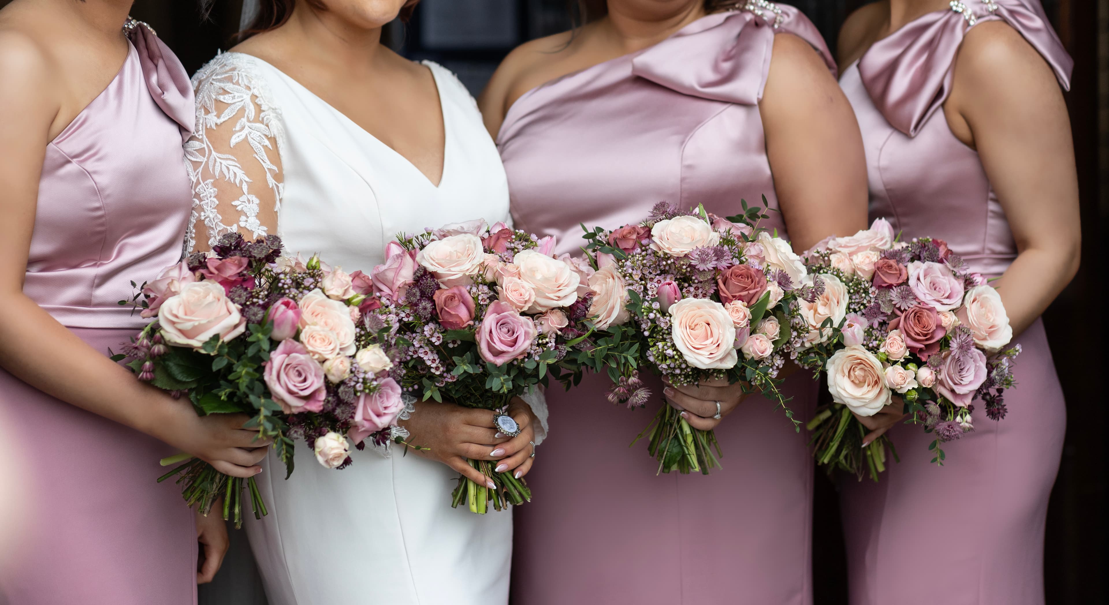Bride and bridesmaids with pink bouquets