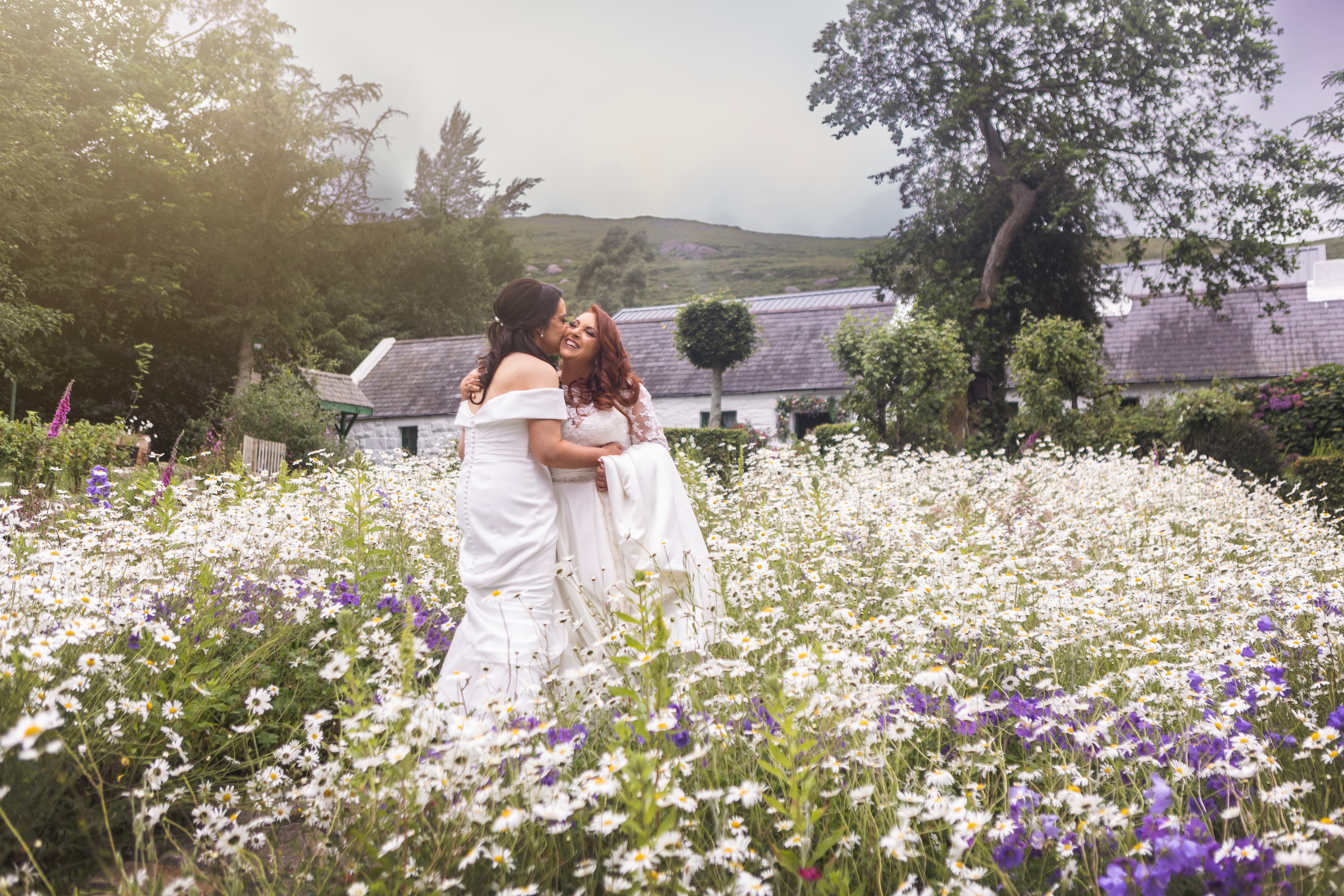 Two brides in a wildflower meadow